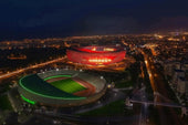WordPress Alt Text for Prince Moulay Abdellah Stadium Image (Copy-paste exactly - 125 chars):  text Prince Moulay Abdellah Stadium Rabat Morocco - 68,700 capacity AFCON 2025 final venue with golden triangular facade and 23,000-seat Kop stand
